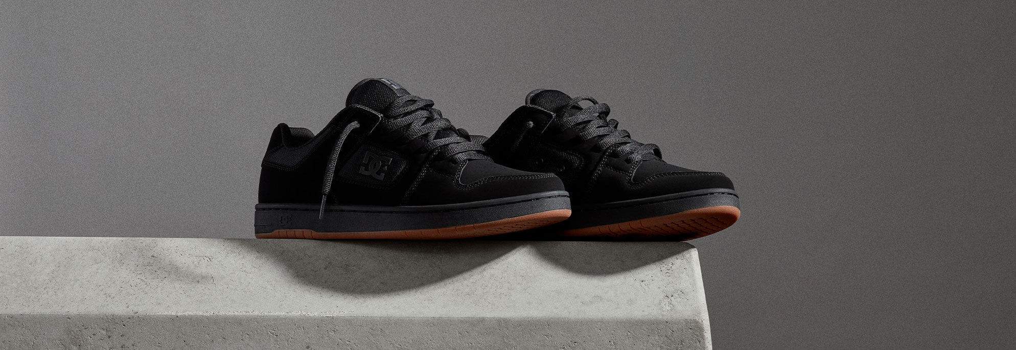 A pair of black shoes on a surface