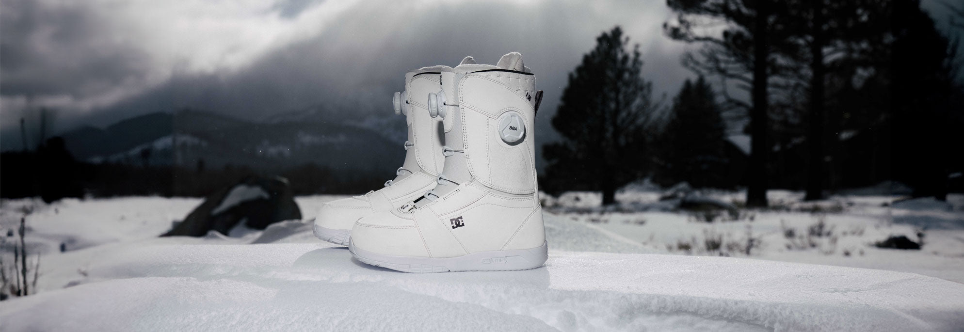 Snowboard Boots with a snowy background