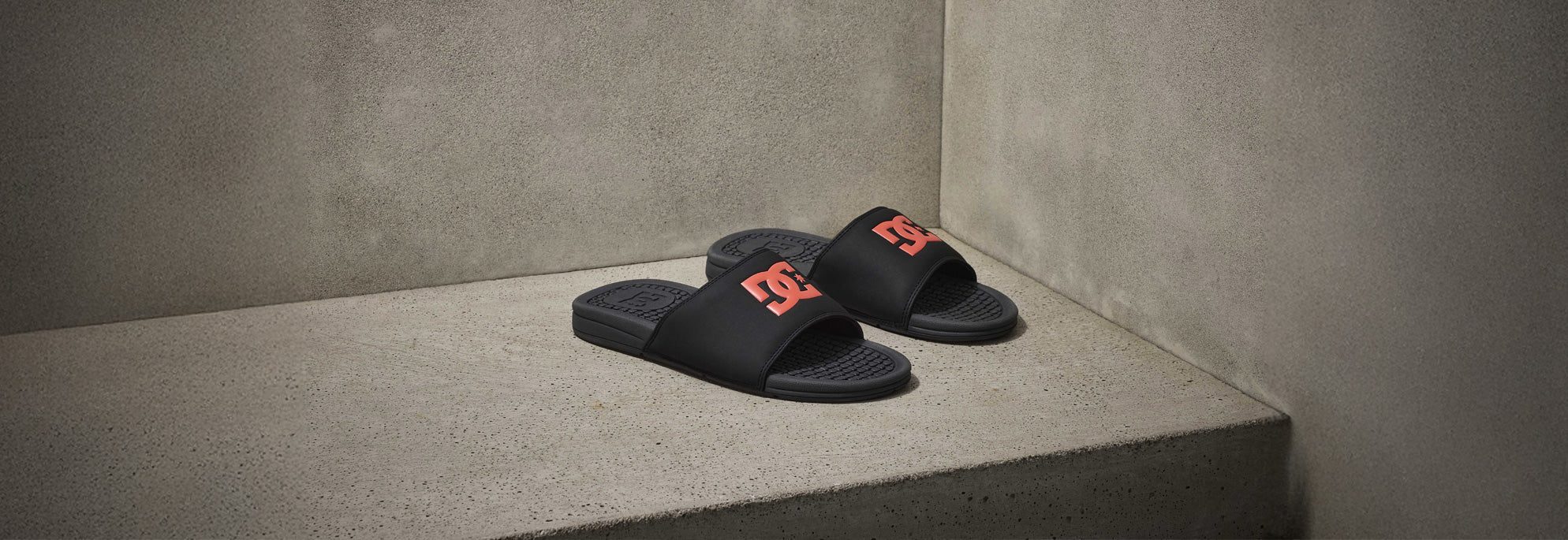 Pair of Men's Slides in black with a red logo