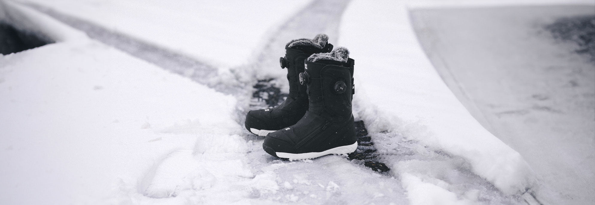 Snowboard Boots with a snowy background