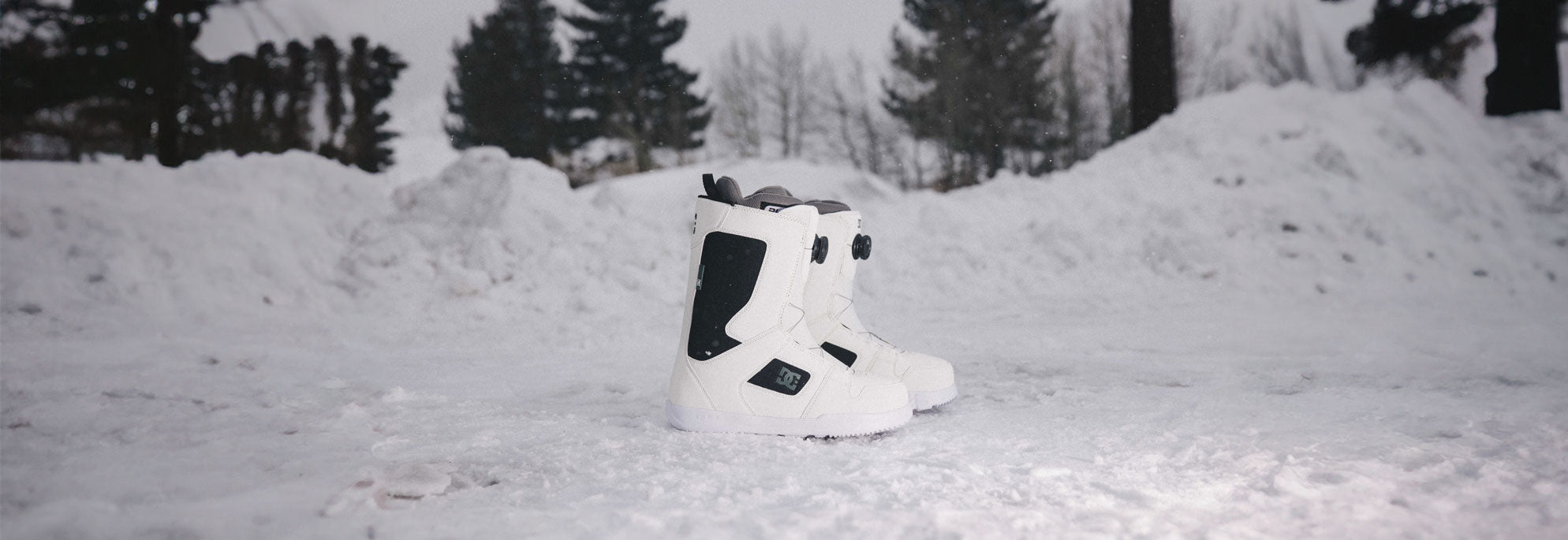 Snowboard Boots with a snowy background