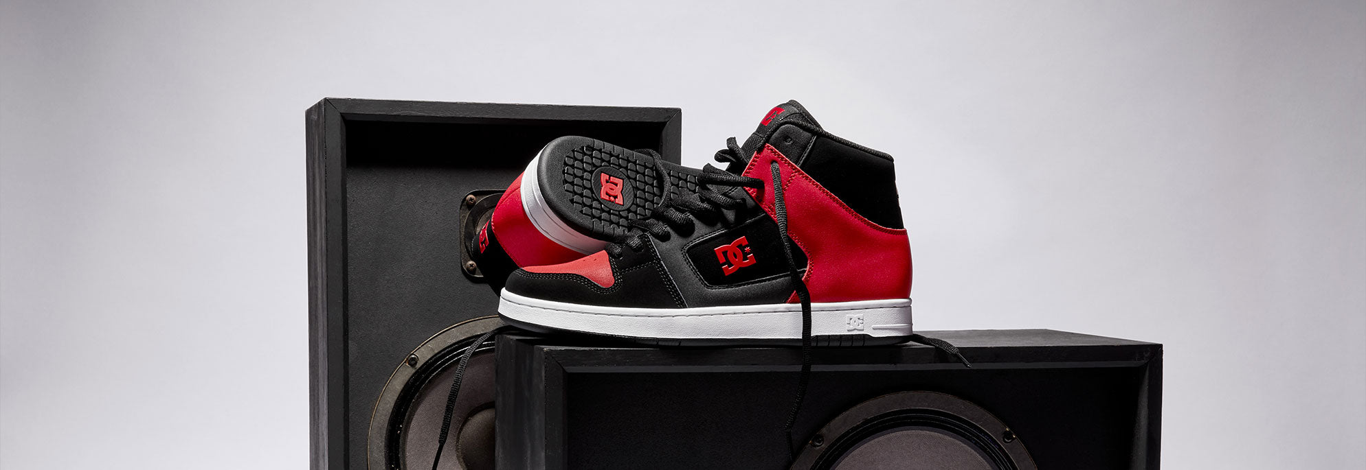A pair of men's sneakers in black and red