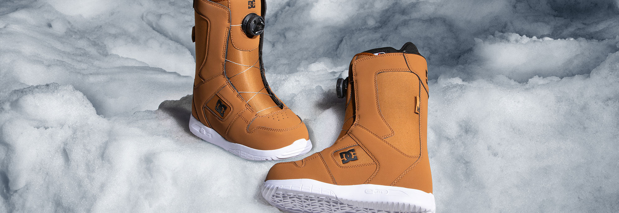 A pair of women's snowboard boots in a wheat color