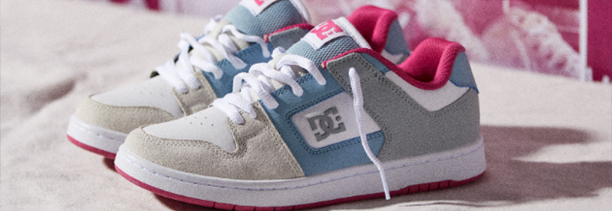 Pair of women's DC Shoes shoes in white, blue, and, pink