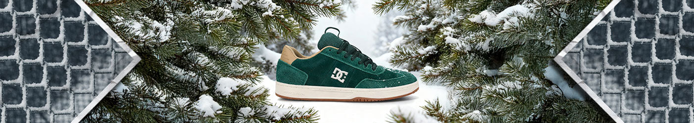 A shoe seen with a snowy wintery backdrop