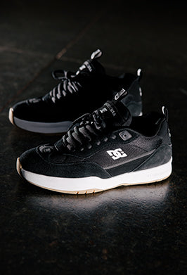 Black DC shoes on a dark surface