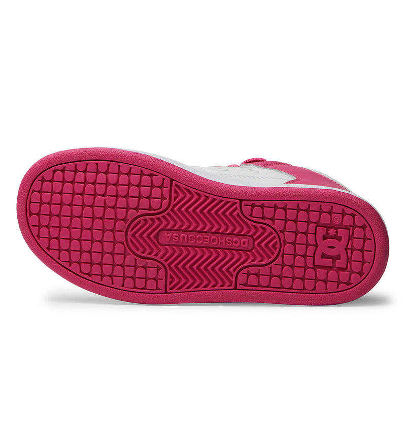 The image shows the sole of the DC Shoes Kids' Manteca 4 HI, mainly pink with a white upper edge. The rubber sole features a textured pattern, DC's logo, and "DCSHOECOUSA" molded into it.