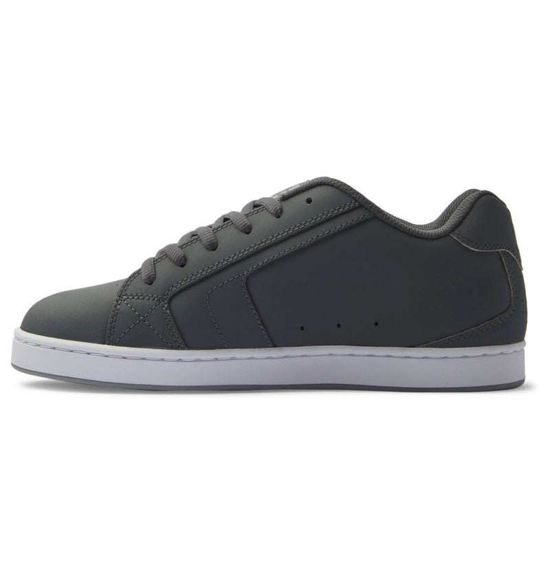 A side view of the Men's Net Shoes by DC Shoes, featuring a dark gray puffy design with matching gray laces and a white sole for all-day comfort, displayed against a plain white background.