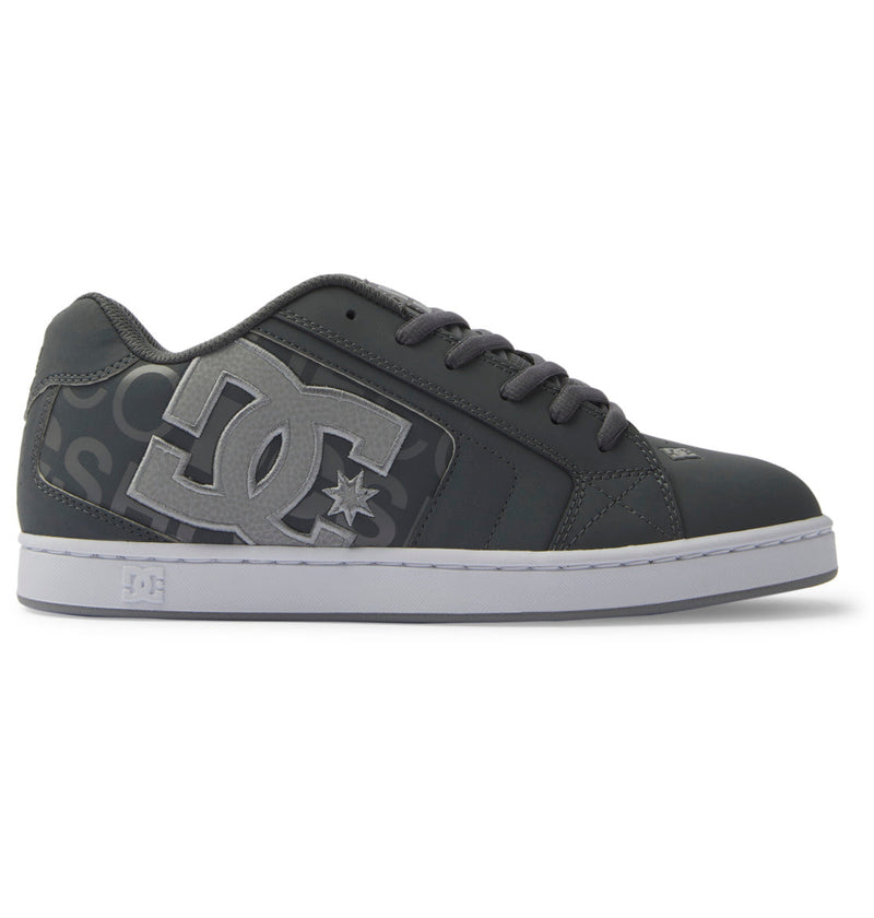 The DC Shoes Men's Net Shoes feature a black and gray design, bold DC logo on the side, black laces, white sole, and a puffy silhouette for all-day comfort.