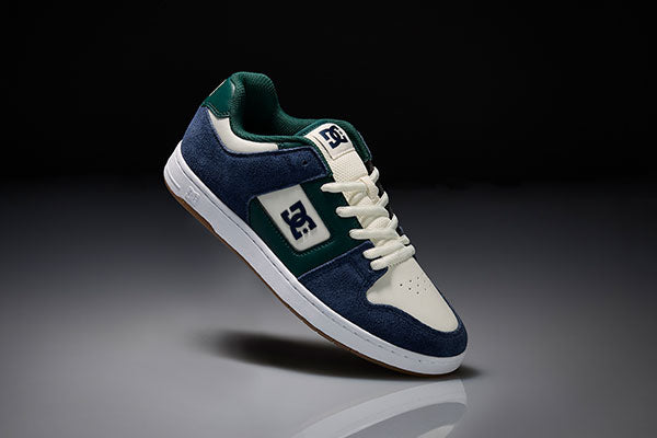 Blue and white Manteca sneaker on a dark background