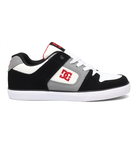 The DC Shoes Kids’ Pure Shoes feature a black, white, and gray design with white laces, a bold red DC Shoes logo on the side and tongue, and a durable white sole for comfortable everyday wear.