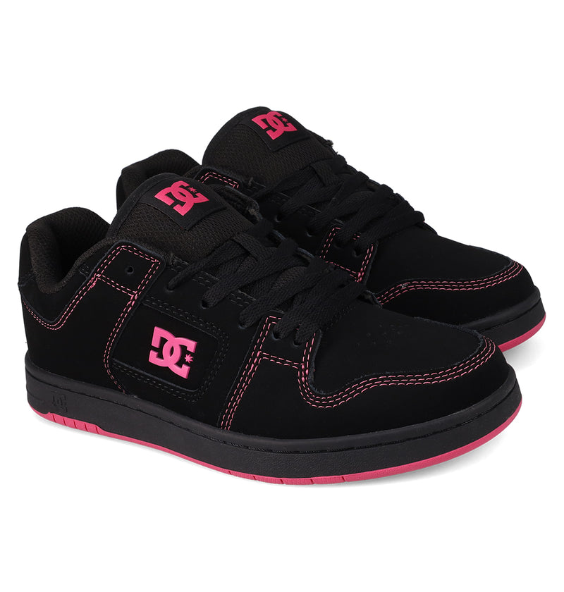 The Women's Manteca 4 Shoes by DC Shoes are black skate shoes with pink stitching, pink DC logos, black laces, black soles accented in pink, and a stylish low-top design.