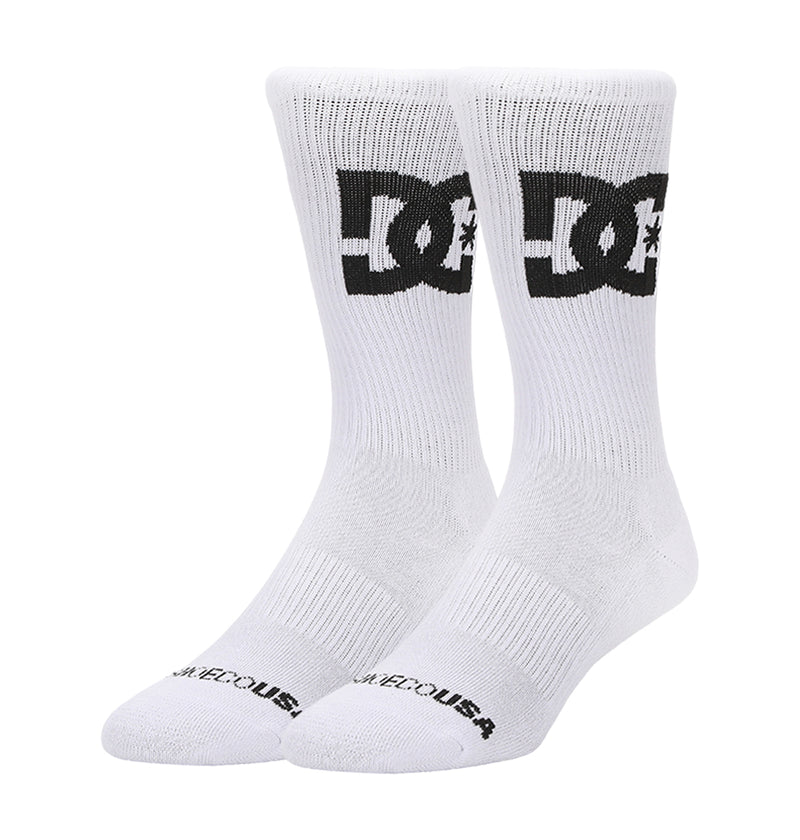 A 3-pack of DC Shoes Big Star Logo crew socks in white, each featuring a bold black DC logo on the sides and "DC SHOES USA" text on the toes, displayed upright against a plain white background.