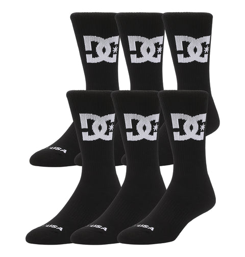 Six pairs (two 3-packs) of DC Shoes Big Star Logo Crew Socks in black, each featuring a white logo on the calf, displayed upright side by side against a white background.