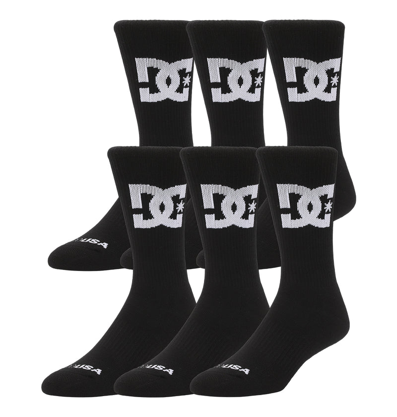 Six pairs (two 3-packs) of DC Shoes Big Star Logo Crew Socks in black, each featuring a white logo on the calf, displayed upright side by side against a white background.