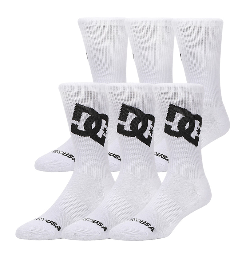 The DC Shoes Graffik Logo Crew Socks 3-Pack includes three pairs of white crew socks featuring the large black DC Shoes logo on the sides and "DC USA" in black near the toes, shown arranged against a white background.