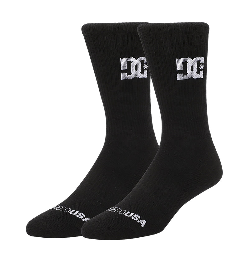 A 6-pack of black DC Shoes crew socks featuring white “DC” logos on the sides and “DC SHOES USA” text on the toes, shown against a plain white background.