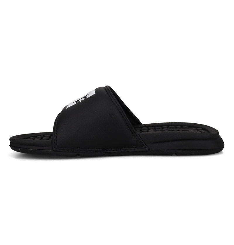 The Kids' Bolsa Slides by DC Shoes are black sandals featuring a thick strap and textured footbed, displayed in side profile against a white background—ideal for kids who want comfortable slides.