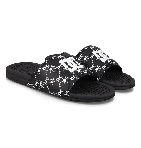 The Men's Bolsa Slides by DC Shoes feature black straps with white logos and decorative patterns, plus textured footbeds and open toes—ideal for your next skate session.