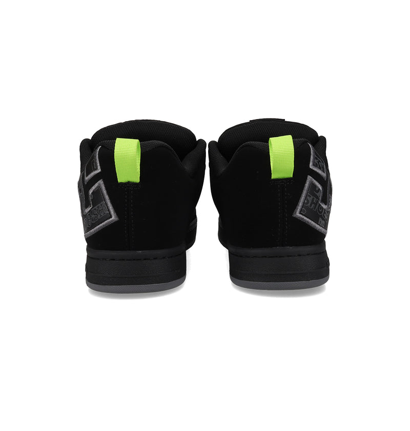Men's Court Graffik Shoes by DC Shoes in black feature gray accents, green heel pull tabs, a chunky sole, and the iconic DC logo. These sneakers have a puffy silhouette and are displayed on a plain white background.