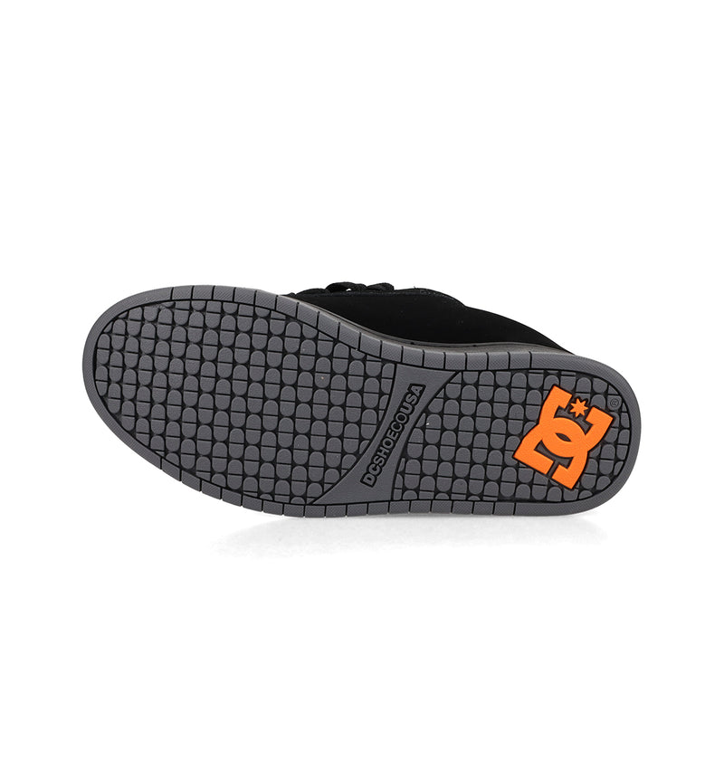 The image displays the gray rubber sole of the DC Shoes Men's Court Graffik, with a patterned tread and an orange logo by the heel, emphasizing this sneaker's classic puffy silhouette.