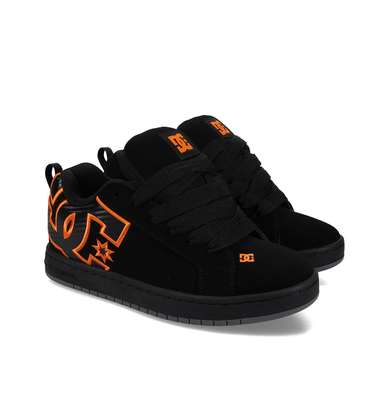 The DC Shoes Men's Court Graffik Shoes feature a black puffy silhouette, thick black laces, orange DC logos on the sides and tongue, plus orange accents on the sole and stitching.