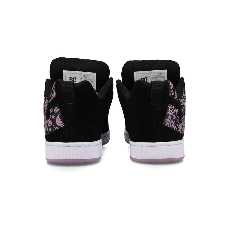 The DC Shoes Women's Court Graffik Shoes feature a chunky black design with purple paisley side patterns and white soles accented by purple on the edges, adding a touch of '90s style.