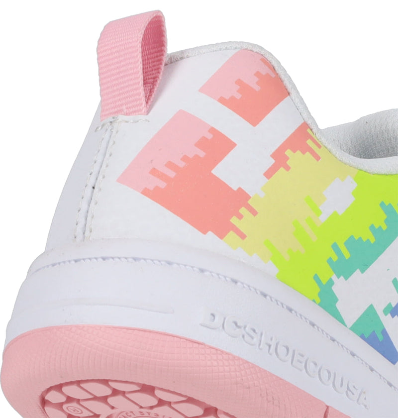 Close-up of the heel of the DC Shoes Kids' Court Graffik Shoes: white sneaker with a pink pull tab, colorful pixelated side design, and a white sole with "DCSHOECOUSA" embossed. Light pink outsole.