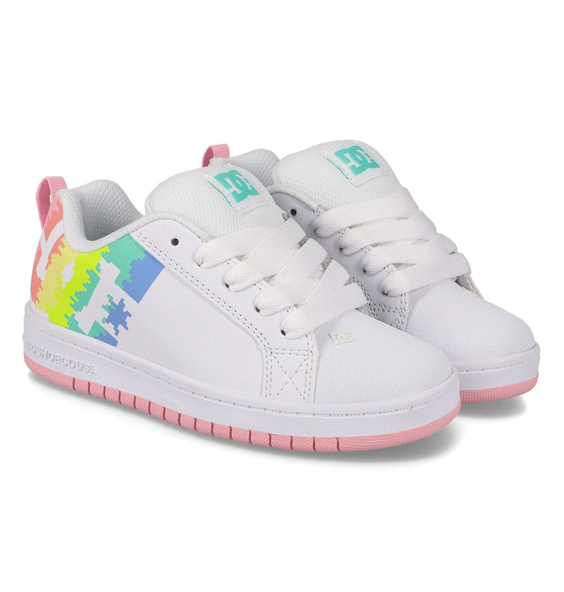 A pair of Kids' Court Graffik Shoes by DC Shoes featuring thick white laces, pink soles, and colorful pixelated rainbow graphics on the sides and heel tabs.