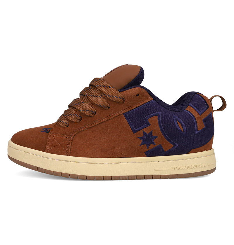 The Men's Court Graffik SE Shoes by DC Shoes feature brown suede, a puffy silhouette, thick brown laces, a beige sole, and a bold navy blue DC Shoes logo on the side.