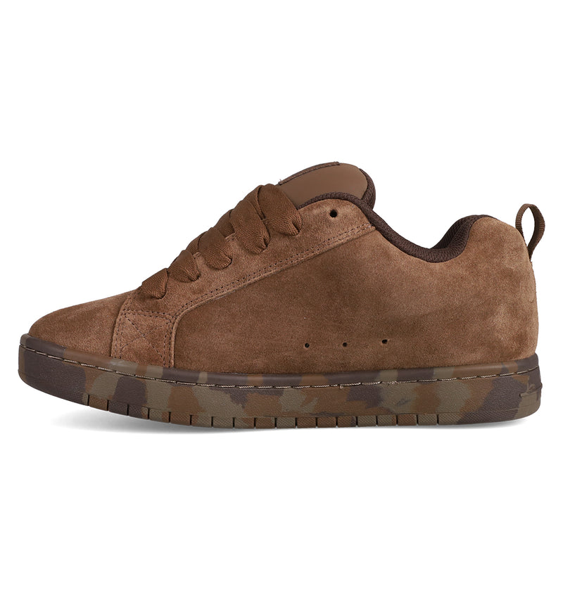 The Men's Court Graffik SE Shoes by DC Shoes feature brown suede, matching laces, a dark brown lining, and a camo-patterned rubber sole. With a puffy silhouette and premium upper, the shoe is shown from the side on a white background.