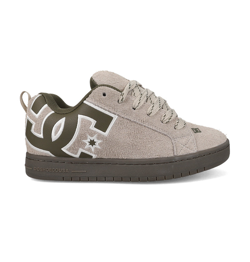 The DC Shoes Men's Court Graffik Special Edition features a beige and olive green puffy silhouette, large side DC logo, textured suede upper, matching laces, and a dark green rubber sole.