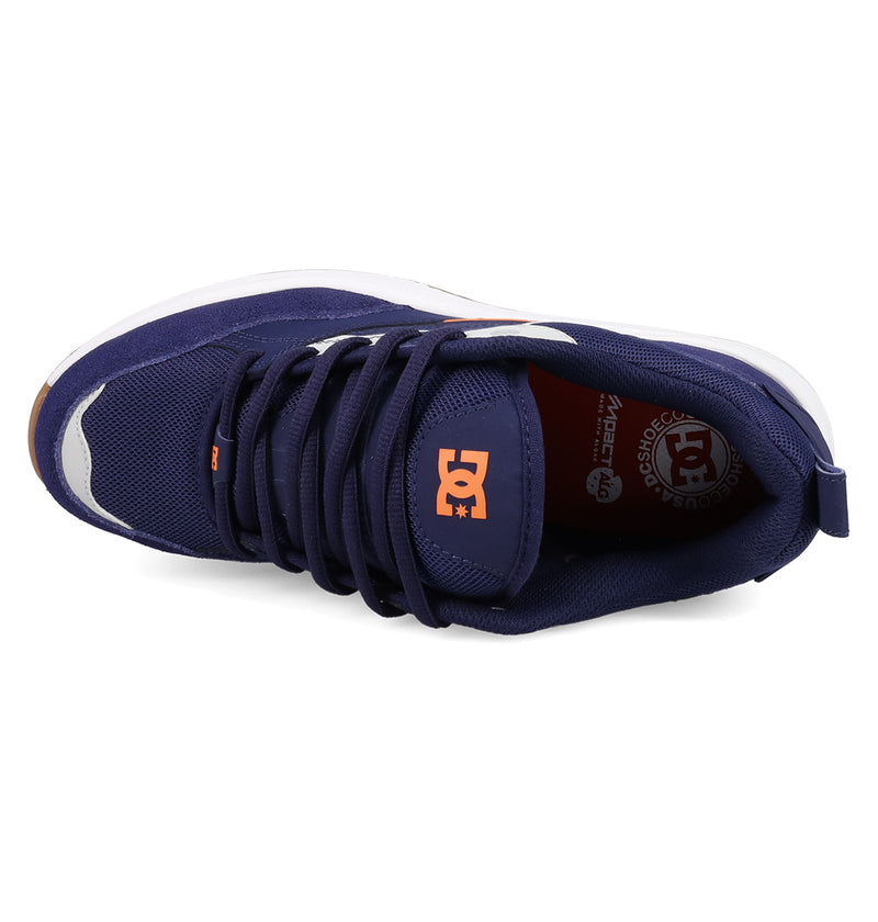 Top view of the Men's DC Ascend S Shoes by DC Shoes in navy blue, featuring an orange logo on the tongue and insole, white side accents, black laces, and modern comfort with classic DC style against a white background.