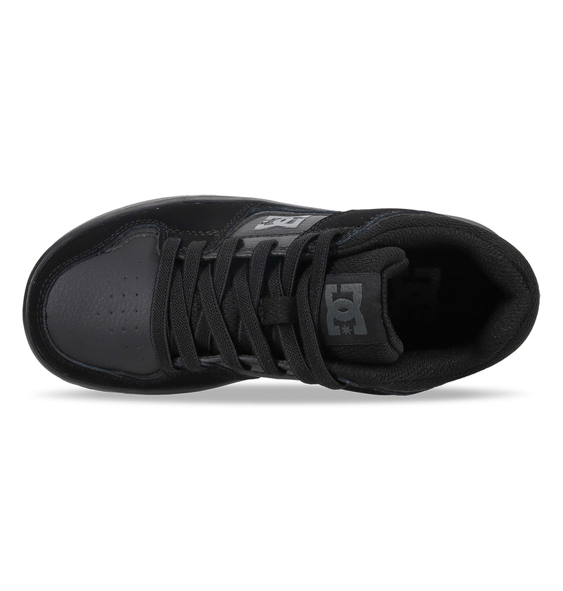 Top view of the Kids' DC Shoes Cure Elastic Shoes by DC Shoes, featuring a sleek black design with black laces, padded tongue with the DC logo, subtle stitching, and a perforated toe area.