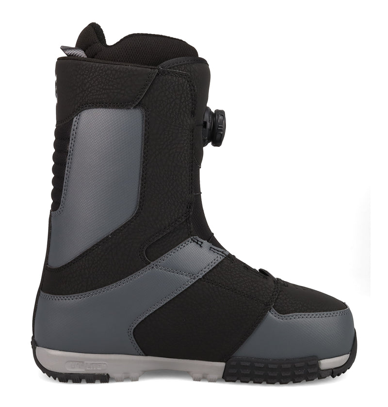 The DC Shoes Men's Control Snowboard Boots, featuring a black and gray design with textured panels, a thick rubber sole, and a Dual Zone BOA Fit System dial lacing system, are shown in side profile on a white background.