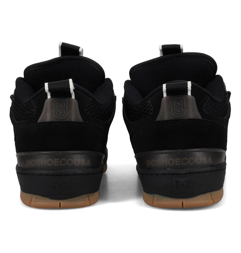 Black athletic shoes with visible brand logo on a white background