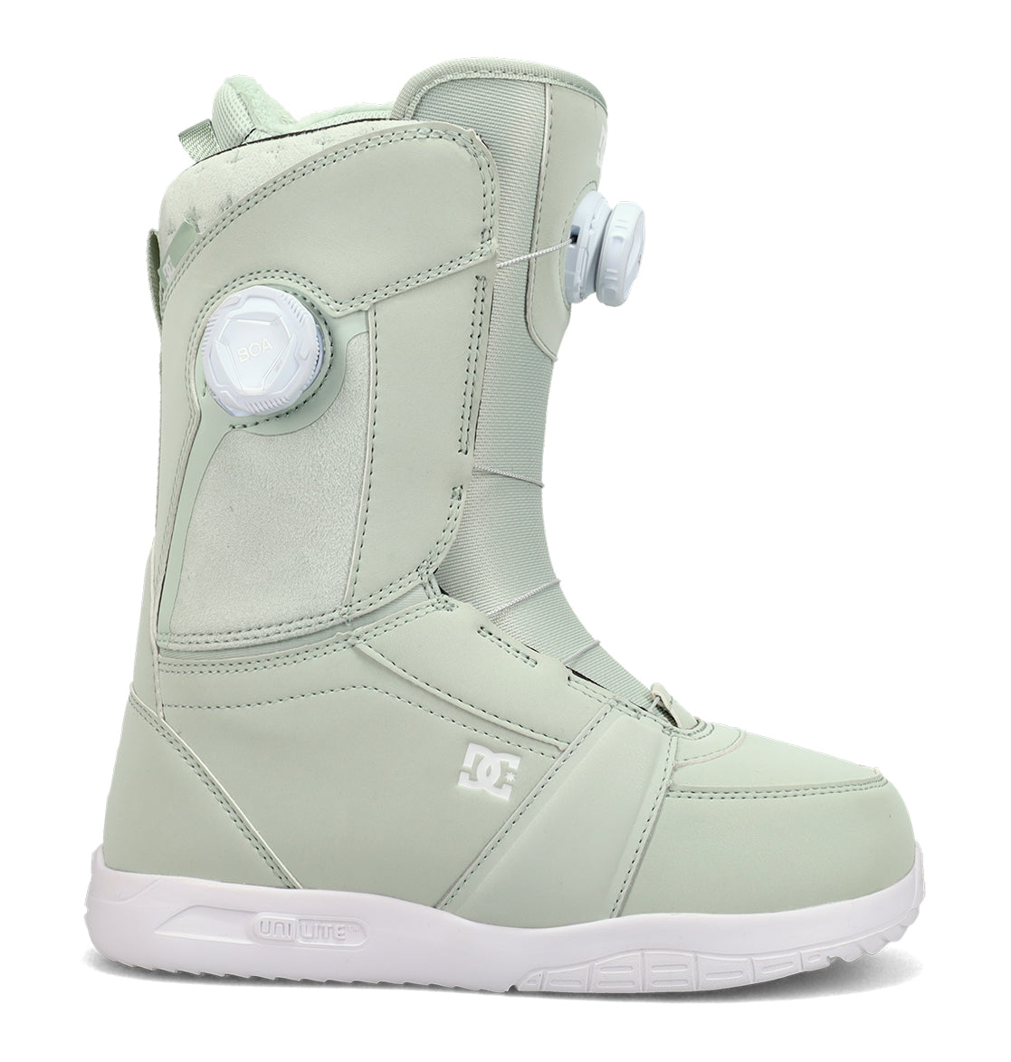 The Women’s Lotus Snowboard Boots by DC Shoes are shown against a plain white background, featuring a light green design with a white sole, a side round tightening dial, and subtle panel stitching for enhanced comfort and support.