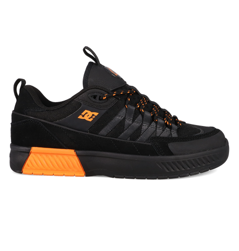 Black and orange sneaker with a brand logo on a white background