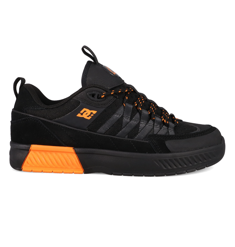 Black and orange sneaker with a brand logo on a white background