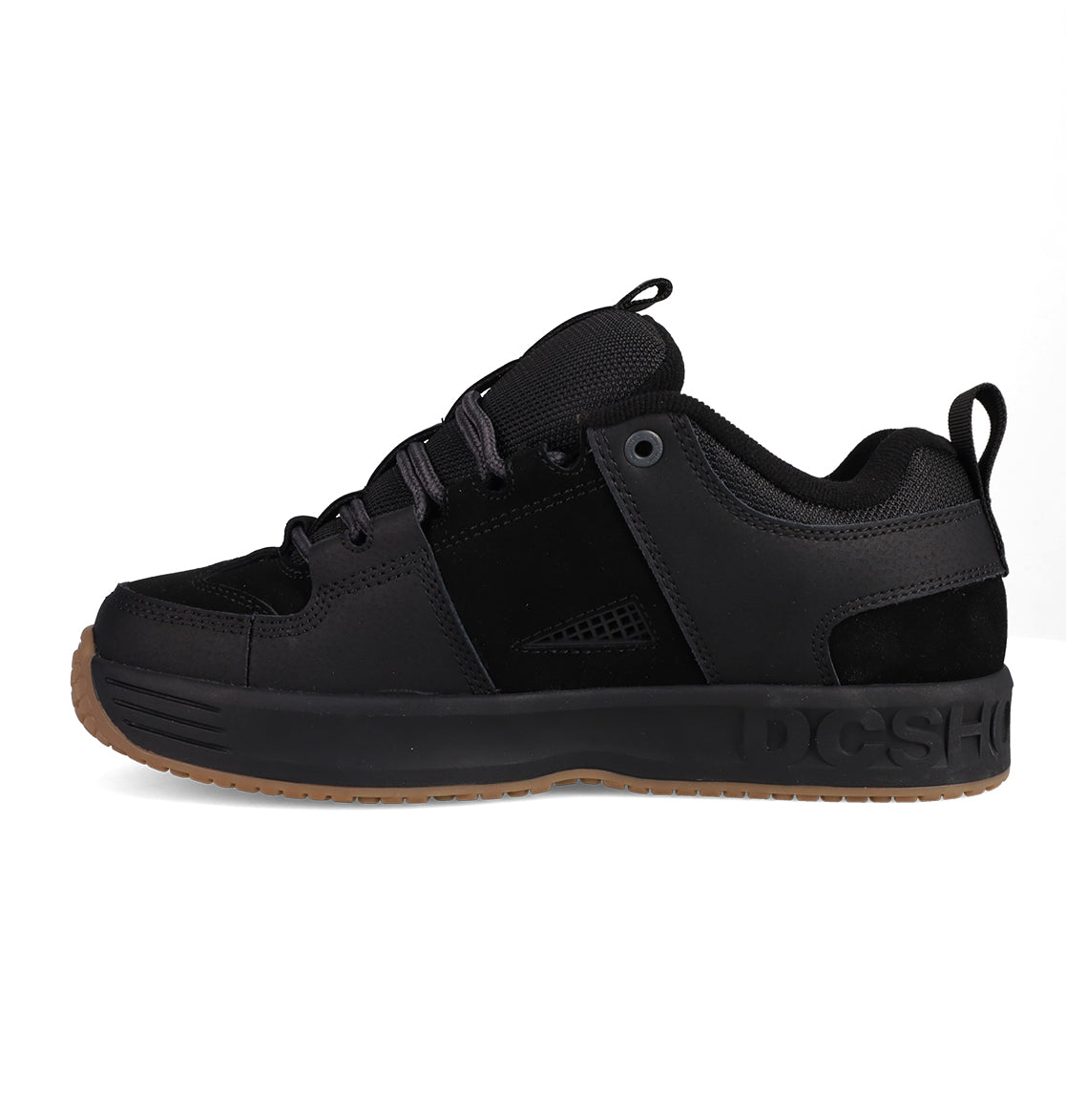 The Men's Lynx OG Shoes by DC Shoes feature black suede and mesh panels, black laces, a thick sole with "DC SHOES" branding, and a brown gum outsole—an iconic skateboarding favorite.