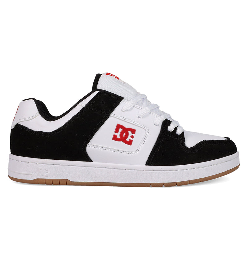 A black and white DC Shoes Men's Manteca 4 with a gum sole, white laces, red DC logo on side and tongue, plus suede accents. This low-cut sneaker offers classic style for skate or streetwear.