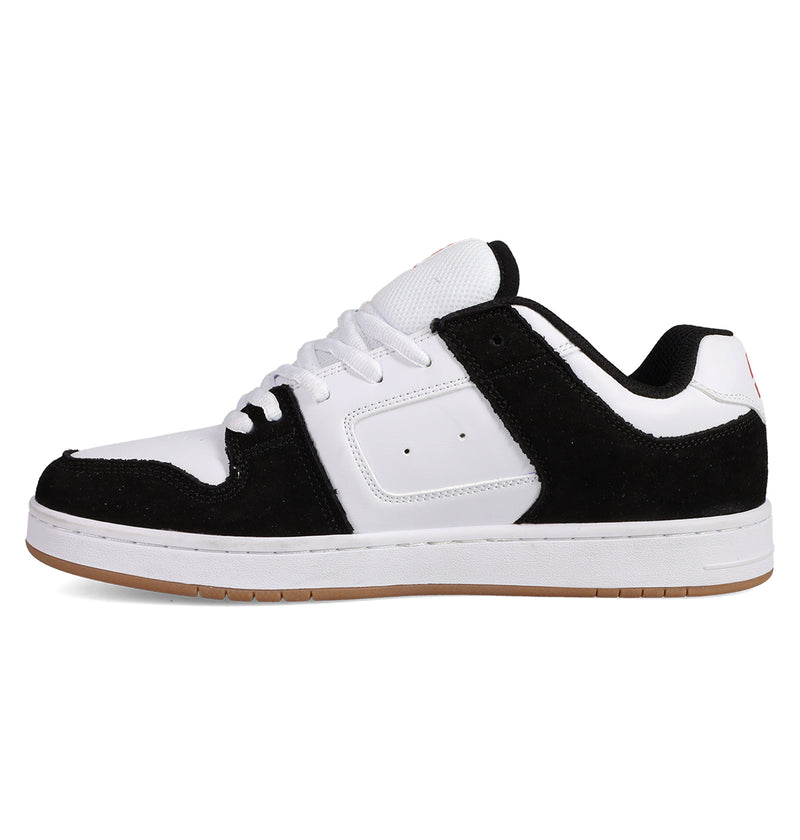 The Men's Manteca 4 Shoes by DC Shoes feature a low-top design with a white sole and upper, black suede overlays and lining, white laces, a gum-colored outsole, and perforations near the midfoot for classic style.