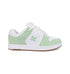 The Women's Manteca 4 Shoes by DC Shoes are low-top sneakers with a white leather upper, light green suede accents, white laces, a brown rubber sole, and the DC Shoes logo on the side.