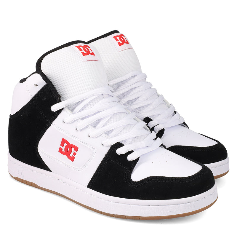 The Men's Manteca 4 Hi Shoes by DC Shoes feature white leather, black suede accents, white laces, a gum rubber sole, and bold red DC logos on the side and tongue for a vintage-inspired look.