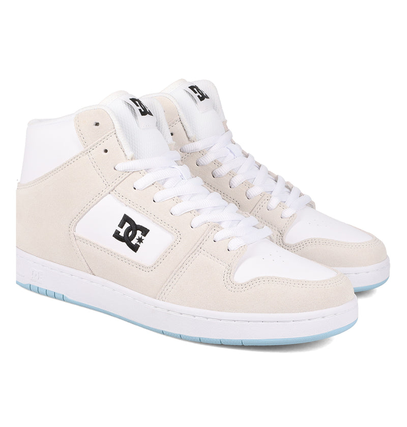 A pair of DC Shoes Manteca 4 Hi high-top sneakers in white and beige with white laces, black DC logos on the sides, and light blue outsoles.