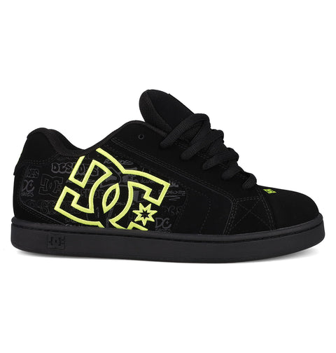 The DC Shoes Men's Net Shoes feature a black puffy design with neon yellow DC branding on the side, subtle logo patterns on the panel, black laces, durable fabric construction, plus a black sole and matching stitching.