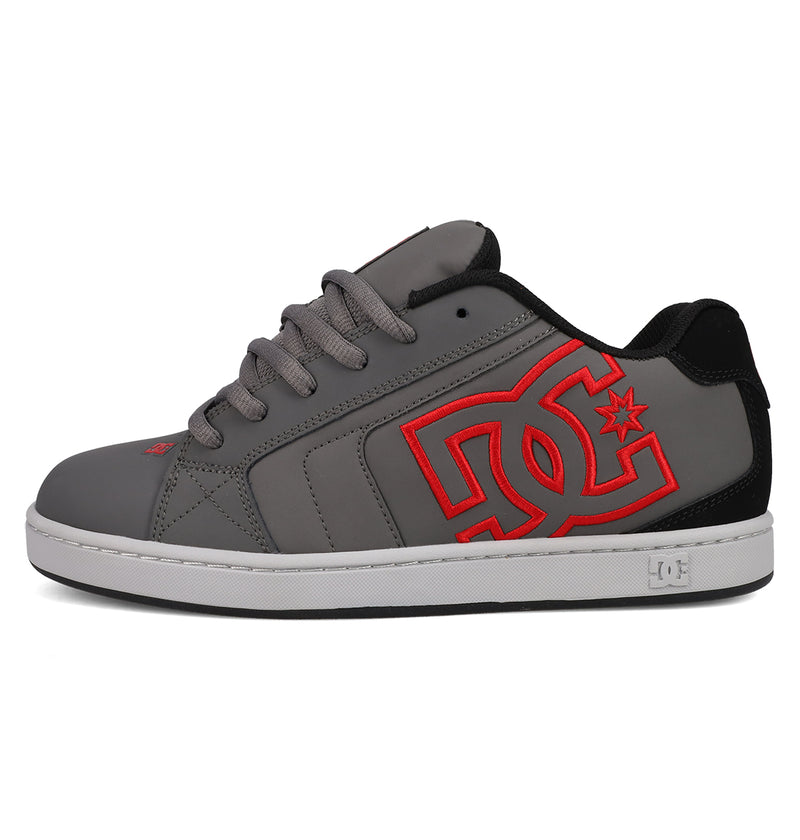 The DC Shoes Men's Net Shoes feature a puffy gray design, black heel, gray laces, white sole, and a bold red DC logo with a star on the side for classic branding.