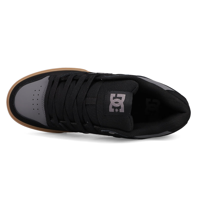 The DC Shoes Men's Pure Shoes feature a black and gray design with a gum sole, black laces, and the DC logo on the tongue—perfect for combining style and comfort.
