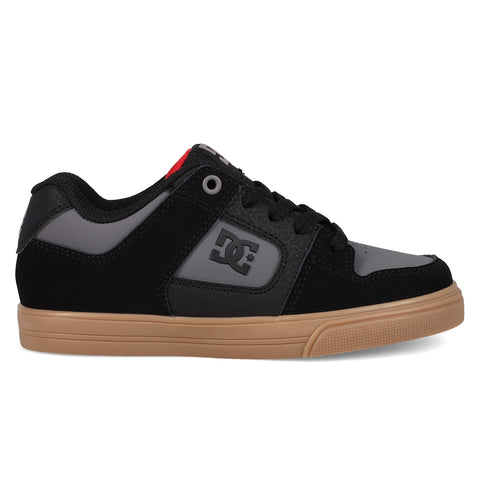 The DC Shoes Kids' Pure Shoes feature a black and grey design with a gum rubber sole, the iconic DC logo on the side, and a red accent near the tongue—offering comfort, style, and versatility for everyday wear.