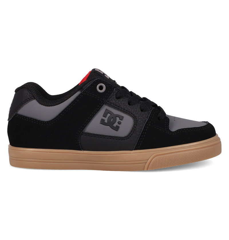 The DC Shoes Kids' Pure Shoes feature a black and grey design with a gum rubber sole, the iconic DC logo on the side, and a red accent near the tongue—offering comfort, style, and versatility for everyday wear.